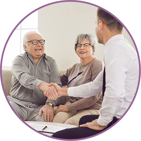 a happy old man shaking hands with a young man